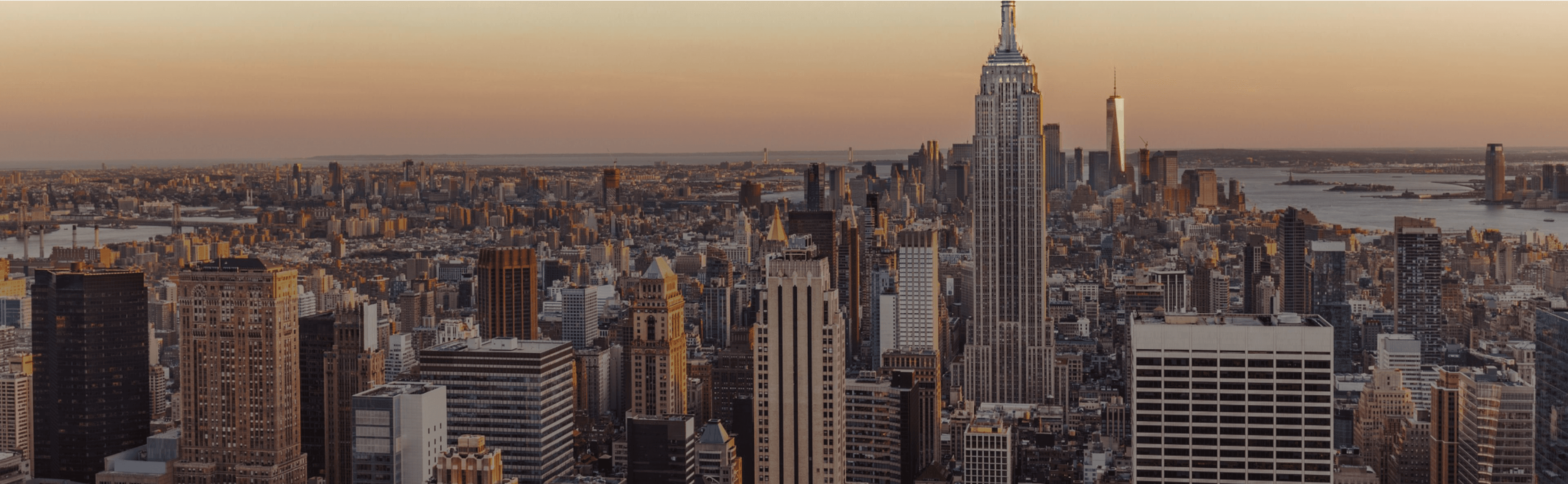 New York Manhattan skyline at dusk with One World Trade Center